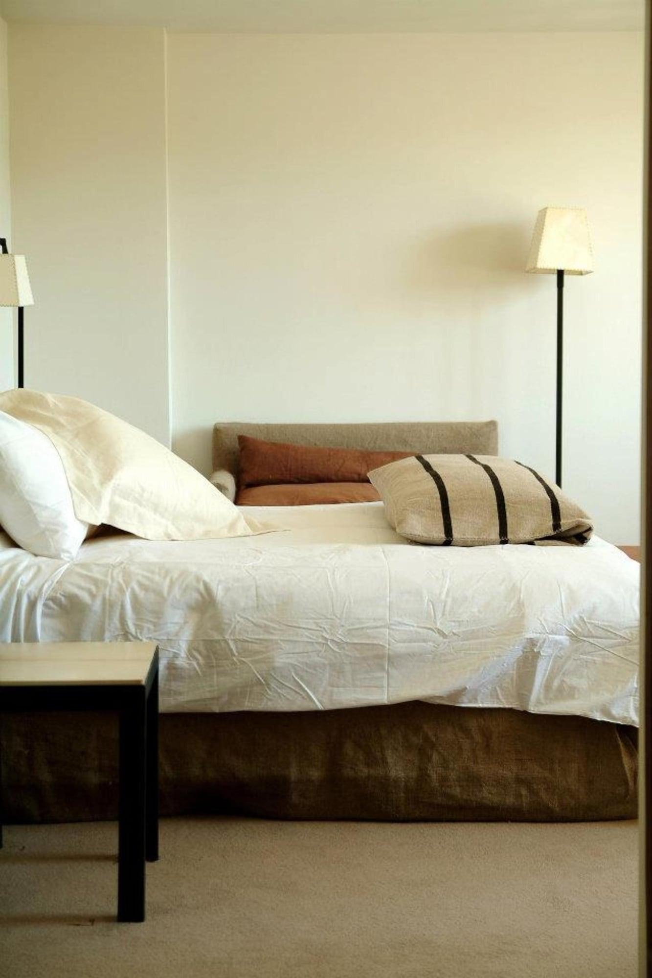 Enjoy Puerto Varas Exterior photo A bed with a bed frame